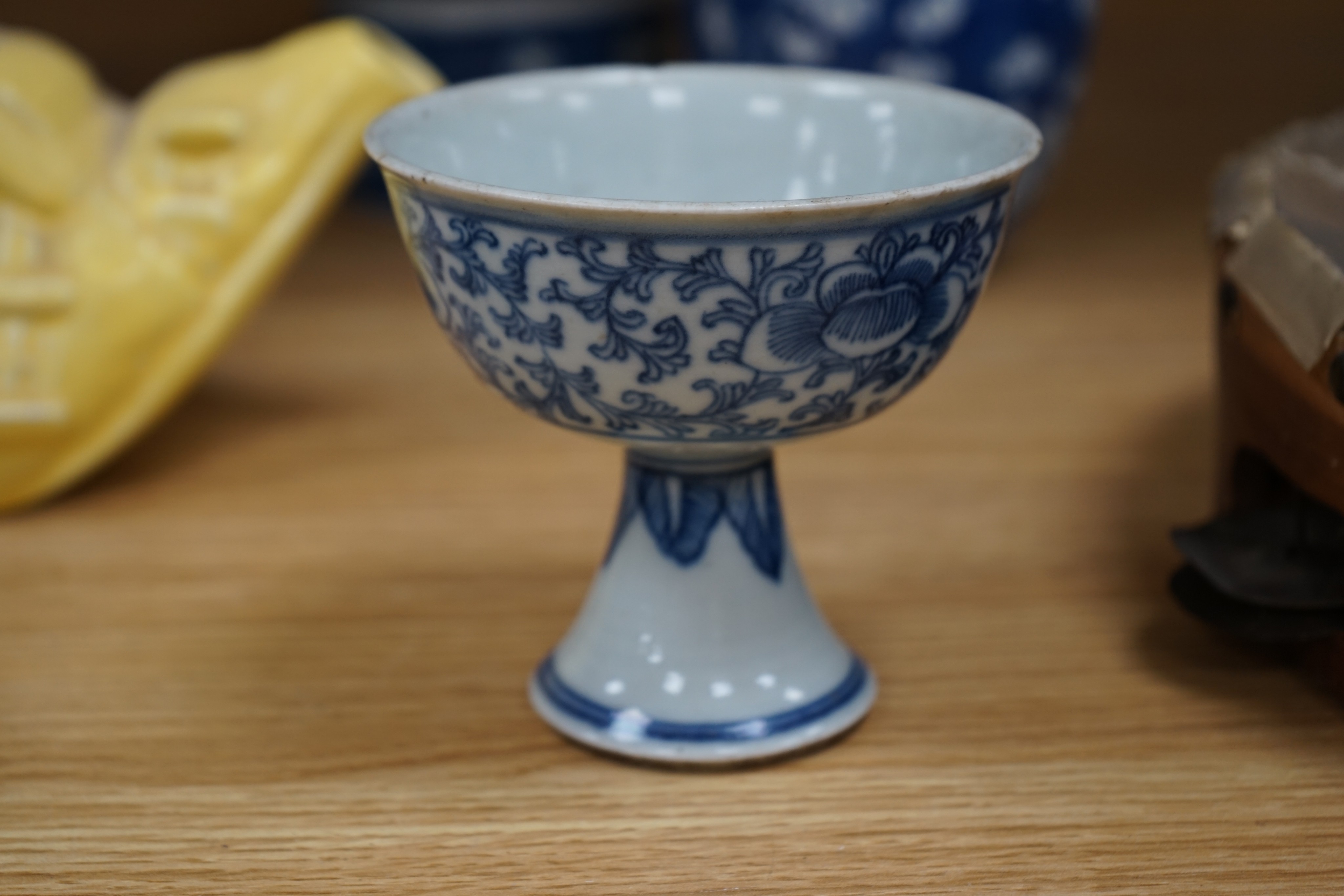 A Chinese blue and white ovoid jar and cover and similar stacking box, Kangxi and a Qing blue and white footed cup, tallest 15cm
